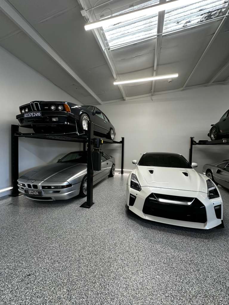 Flake garage floor with sports cars